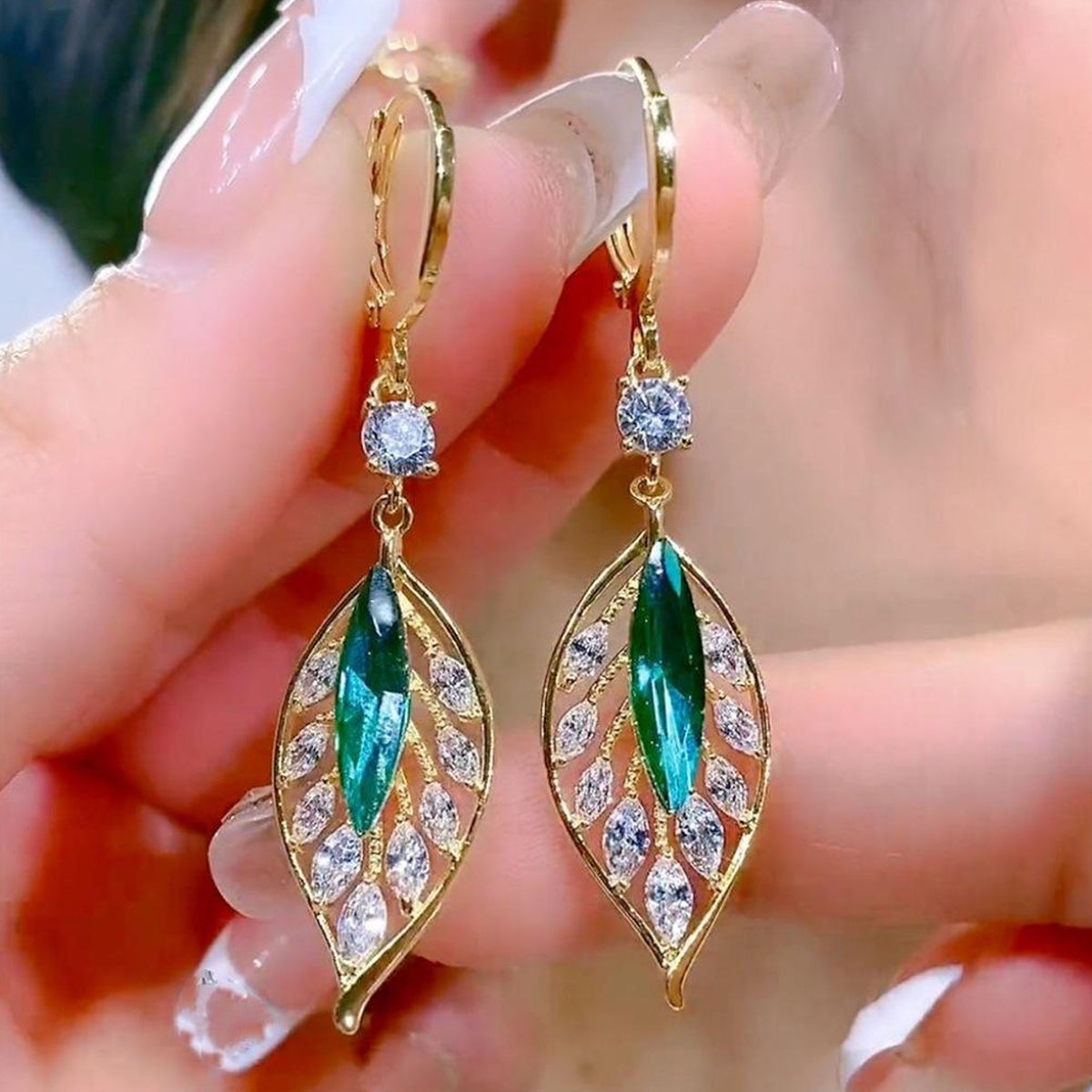 Jazz And Sizzle Gold Plated Green & clear Stone Leaf-knot Design Hoop Earrings for Women