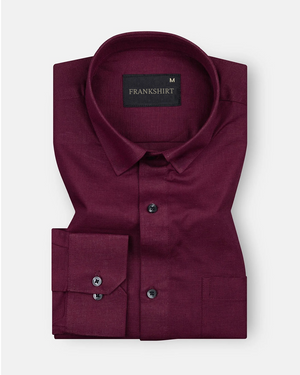 A maroon colored, long-sleeved, button-down linen shirt by Frankish.