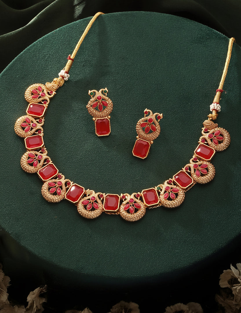 Jazz And Sizzle Gold-Plated Ruby Red Stone Studded- Peacock Necklace Set