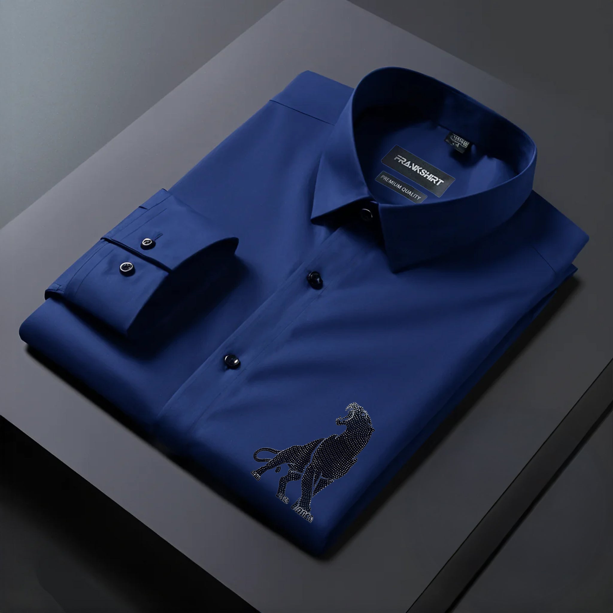 Blue dress shirt with a dog embroidery on a dark surface