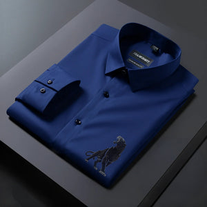 Blue dress shirt with a dog embroidery on a dark surface