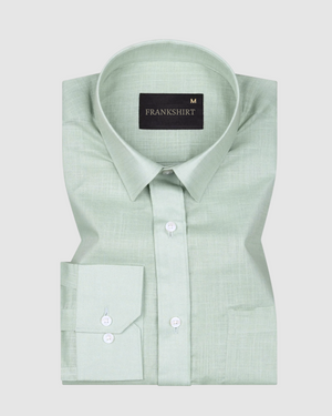 A pista green, long-sleeved, button-down linen shirt by Frankshirt displayed against a white background.