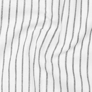 Close-up of fabric with wavy black stripes on a white background
