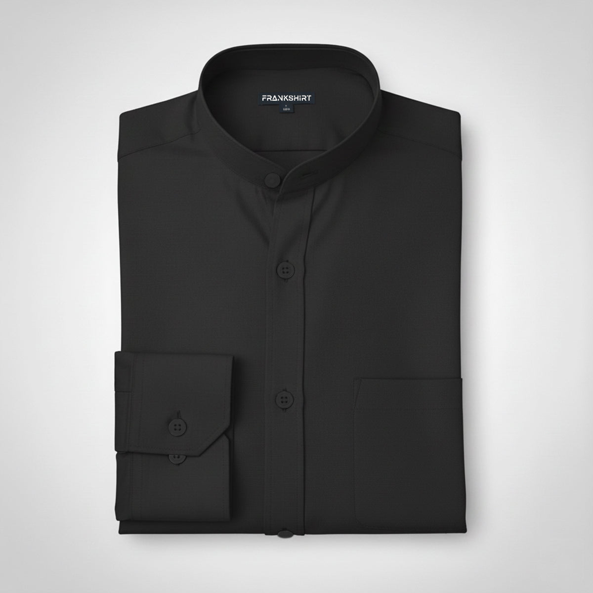 Folded black dress shirt with 'FRANKSHIRT' branding on a light gray background