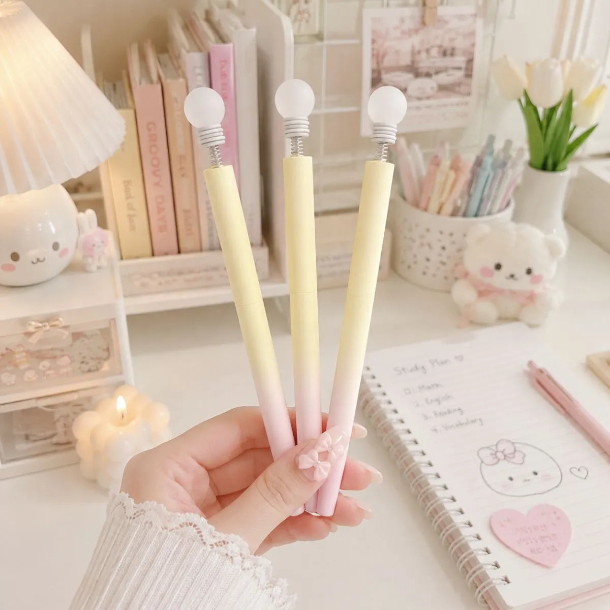 Three Yellow Bulb Pens Held by a Hand - Tinyminymo
