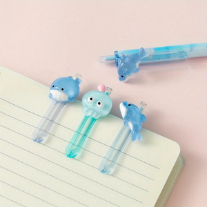 Three Different Designs of Ocean World Gel Pen Clipped to a Notebook - Tinyminymo