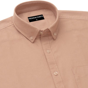 Close-up of a beige shirt with a collar and 'Premium Shirts' label on a white background