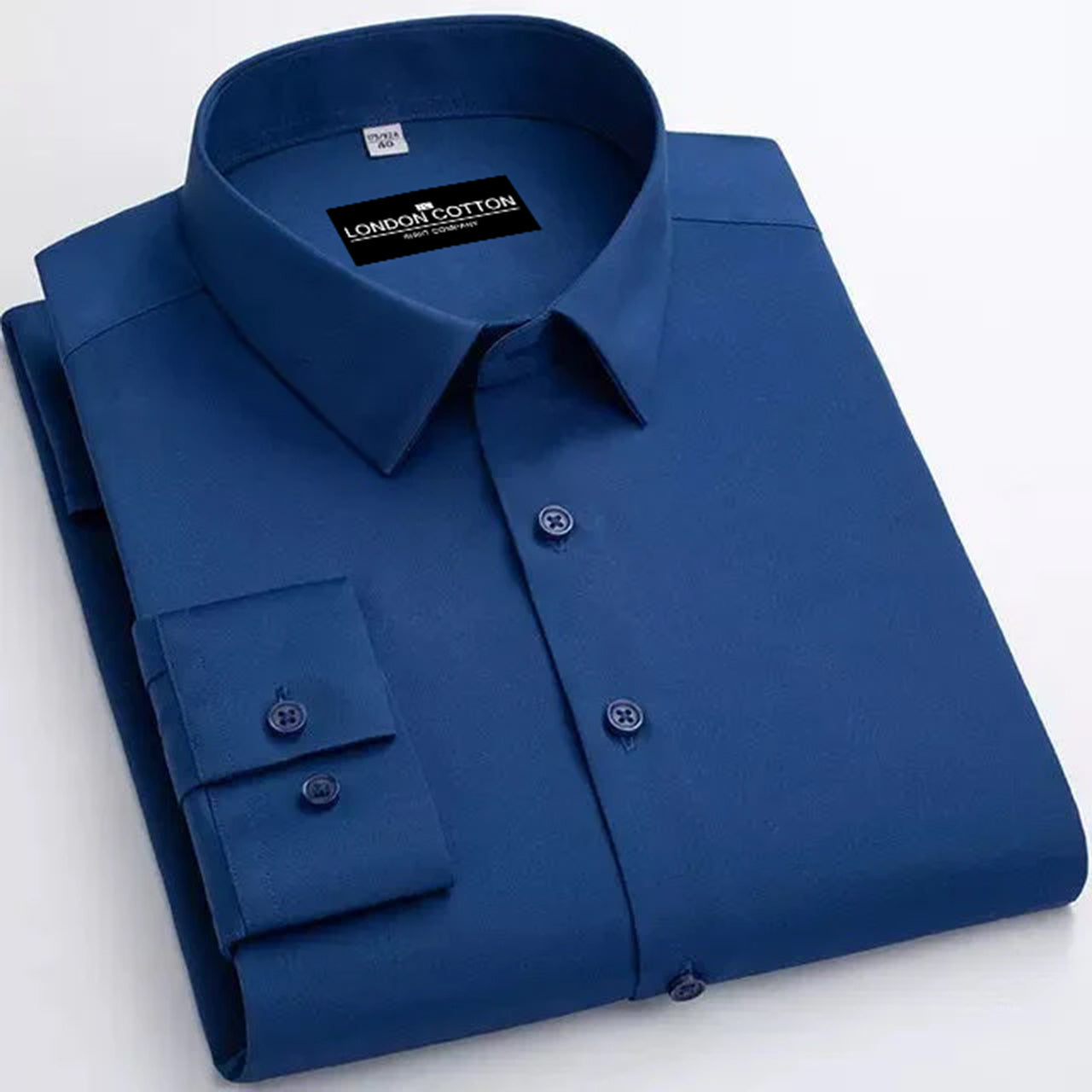 Folded blue shirt with 'London Cotton' label on a white background