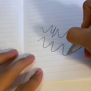Writing with a Grey Shark Pen - Tinyminymo