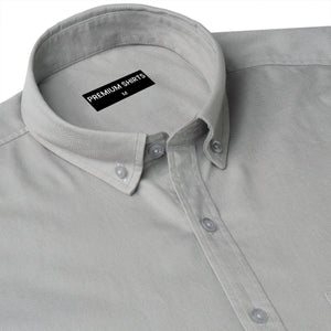 Gray shirt with a collar tag labeled 'Premium Shirts' on a white background