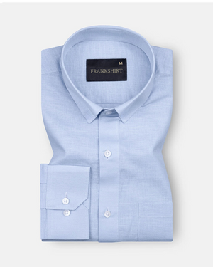 A sky blue, long-sleeved, button-down linen shirt by Frankshirt displayed against a white background.