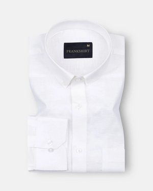A white, long-sleeved, button-down linen shirt by Frankshirt laid out flat on a plain background.