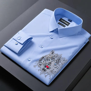 Light blue dress shirt with a tiger emblem on a dark surface