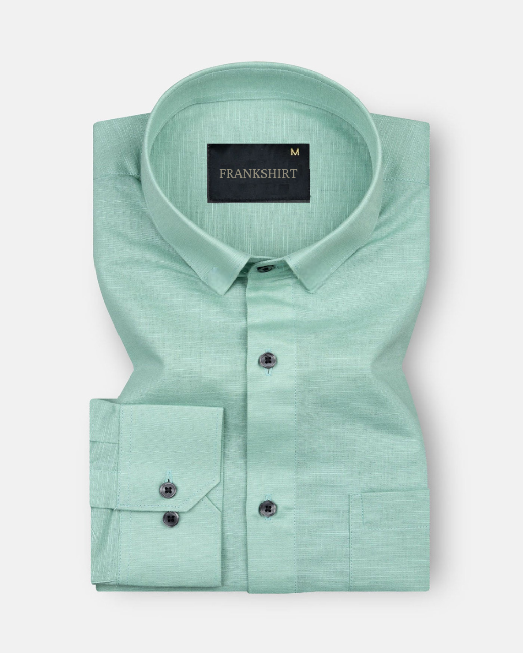 A green, long-sleeved, button-down linen shirt with a chest pocket on the left side.