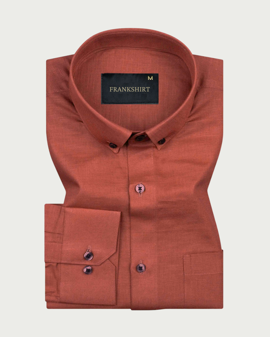 A brown, long-sleeved, button-down linen shirt by Frankshirt laid out flat on a white background.