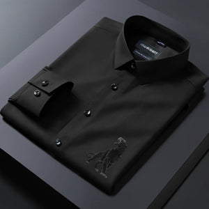 Black dress shirt with an eagle emblem on a dark surface