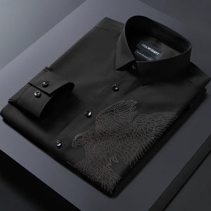 Black dress shirt with an eagle design on a dark surface