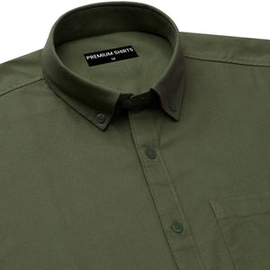 Green shirt with collar and button details, featuring a brand label.