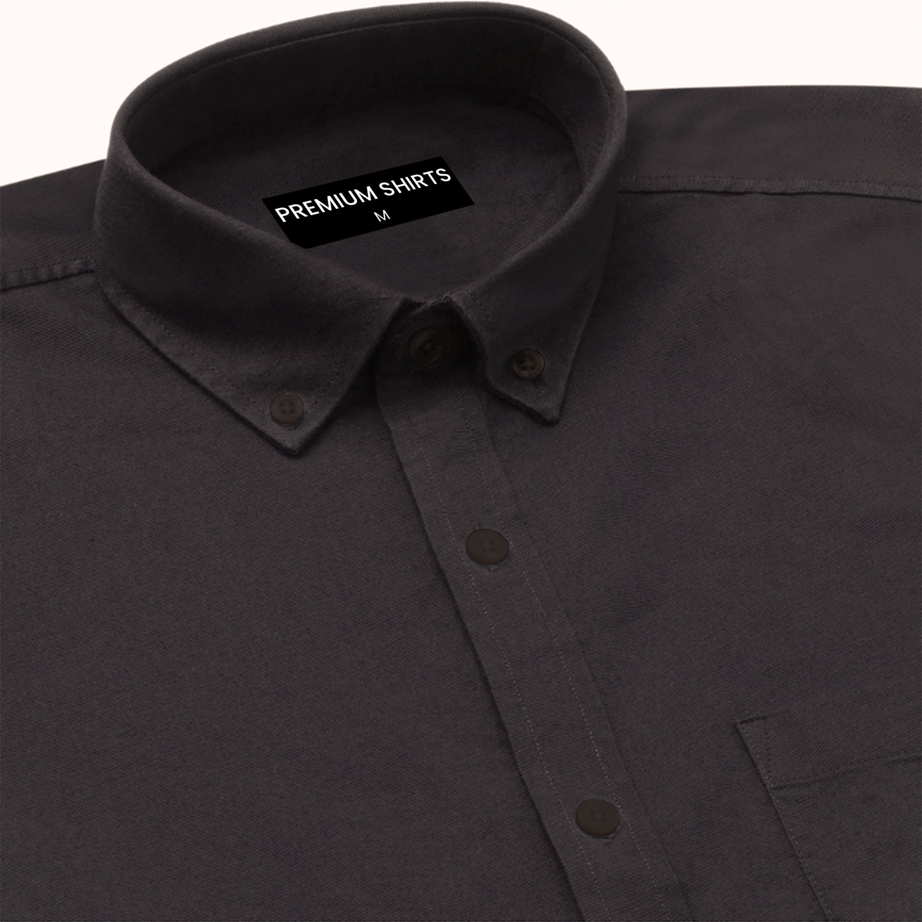 Close-up of a black shirt with a 'Premium Shirts' label on the collar.