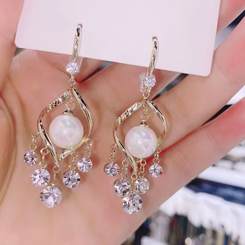 Jazz And Sizzle Stylish Gold Bow Stud Long Earrings With Ball Drop