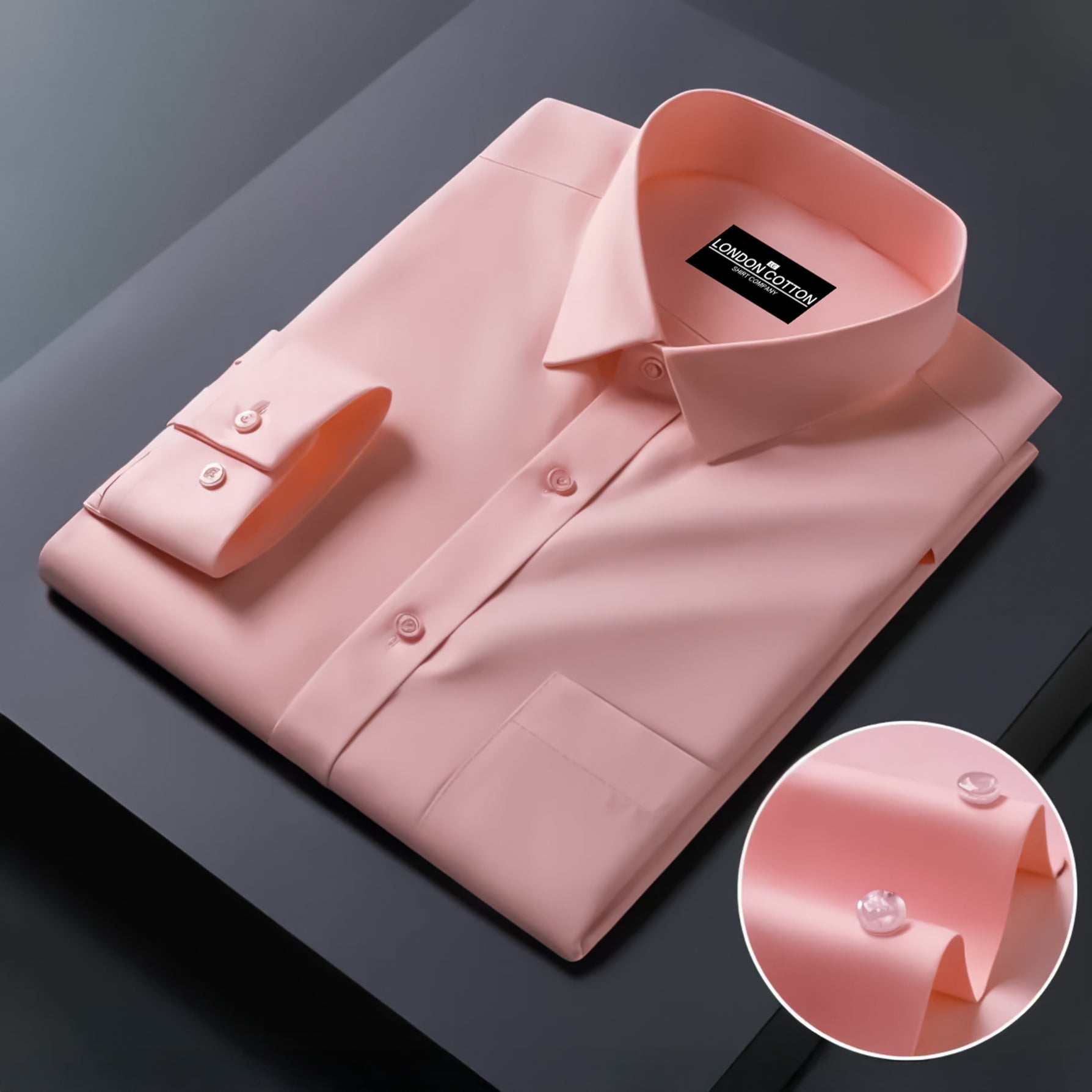 Pink dress shirt with a close-up of the collar on a dark background
